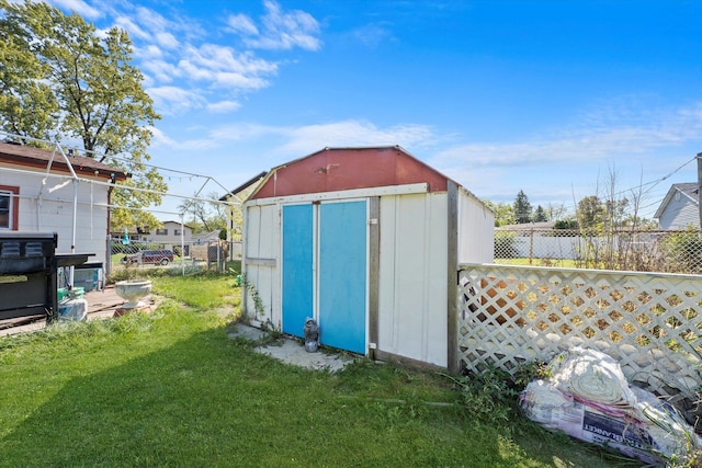 view of shed with fence