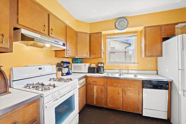 kitchen featuring white appliances and sink