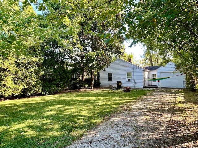 view of yard featuring a garage