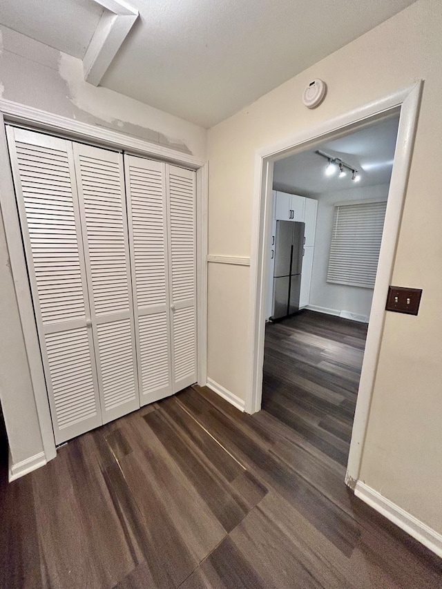 corridor with dark wood-type flooring