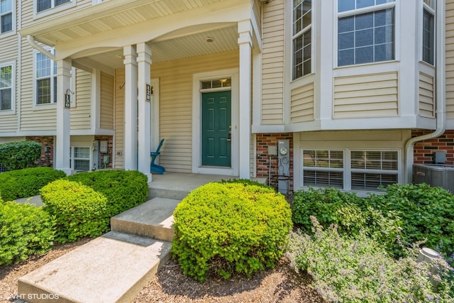 view of exterior entry with covered porch