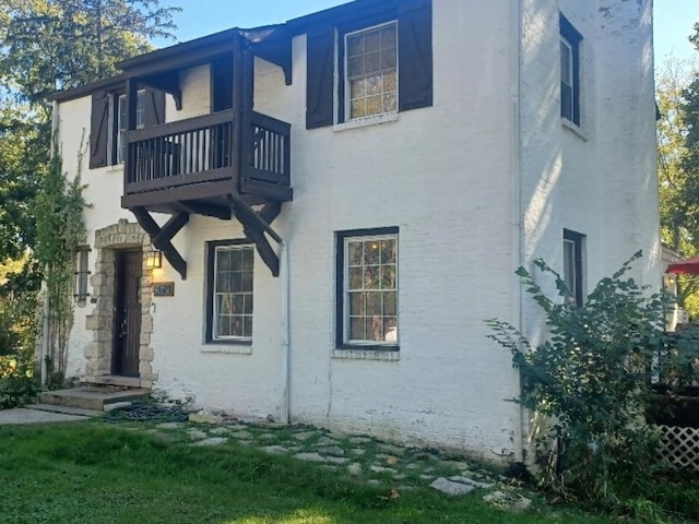 view of home's exterior featuring a balcony