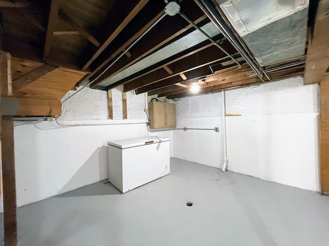 basement featuring fridge