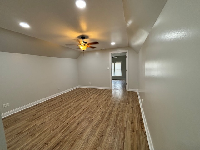 interior space with lofted ceiling, ceiling fan, and hardwood / wood-style flooring