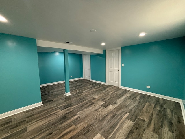 basement with dark wood-type flooring