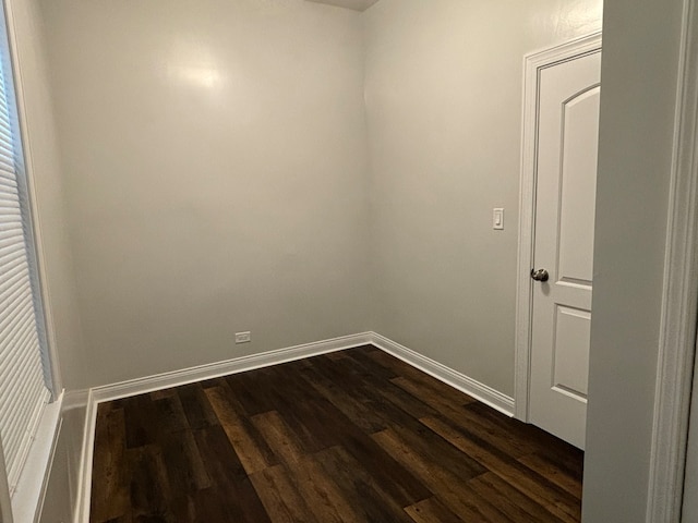 spare room with dark hardwood / wood-style floors