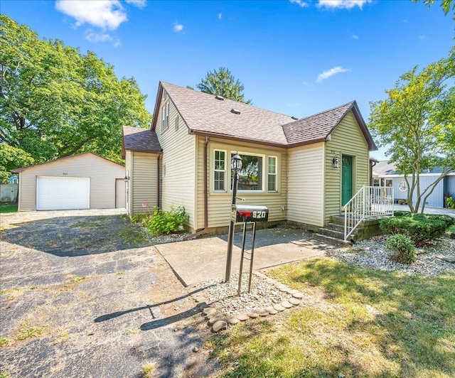 view of front of house featuring an outbuilding and a garage