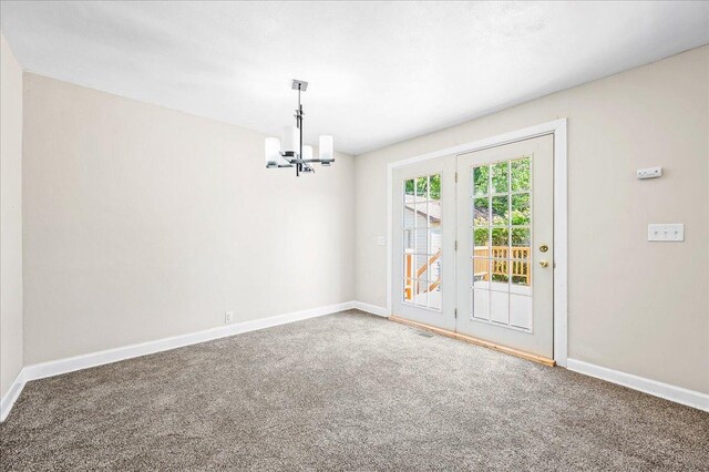 920 S 5th St, Watseka, IL 60970 - spare room with a chandelier, visible vents, baseboards, and carpet
