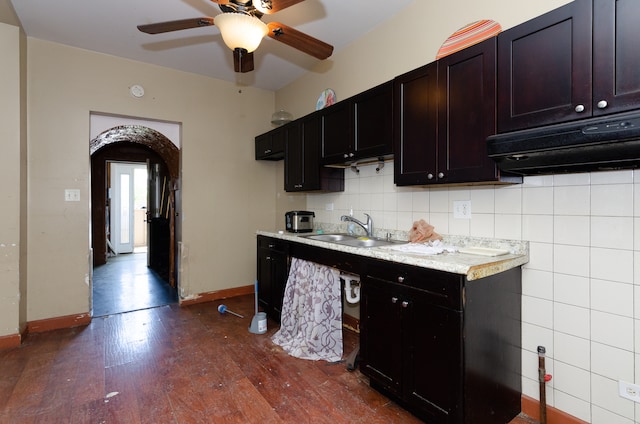 kitchen with dark hardwood / wood-style floors, decorative backsplash, sink, and ceiling fan