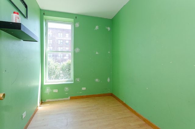 unfurnished room featuring light hardwood / wood-style flooring