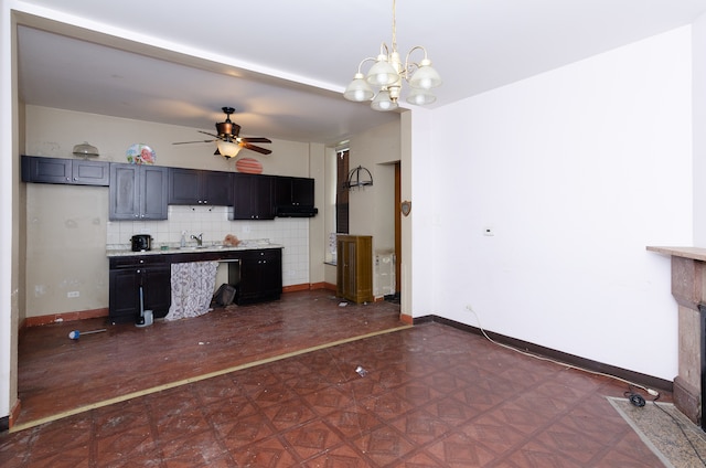 kitchen with ceiling fan with notable chandelier, tasteful backsplash, and sink