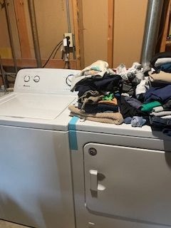 washroom with washing machine and clothes dryer