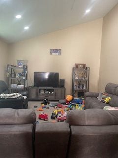 living room with lofted ceiling