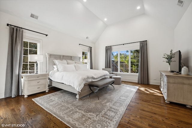 bedroom with dark hardwood / wood-style flooring and high vaulted ceiling