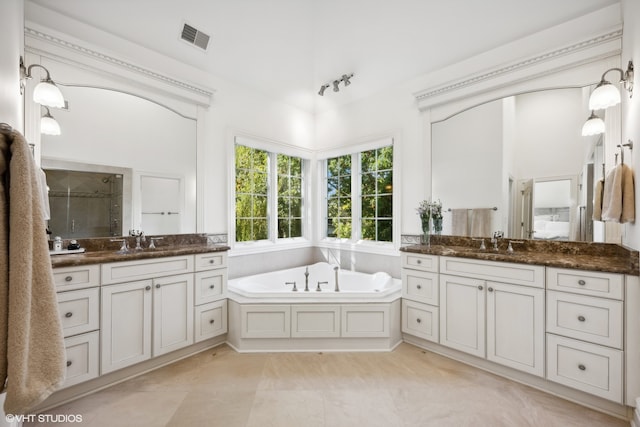 bathroom with vanity, separate shower and tub, and tile patterned floors