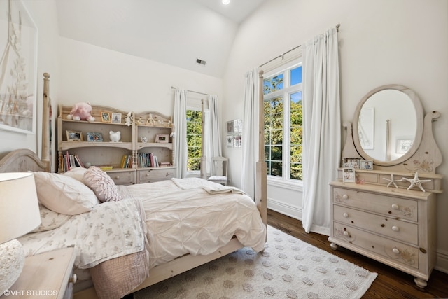 bedroom featuring dark hardwood / wood-style floors and vaulted ceiling