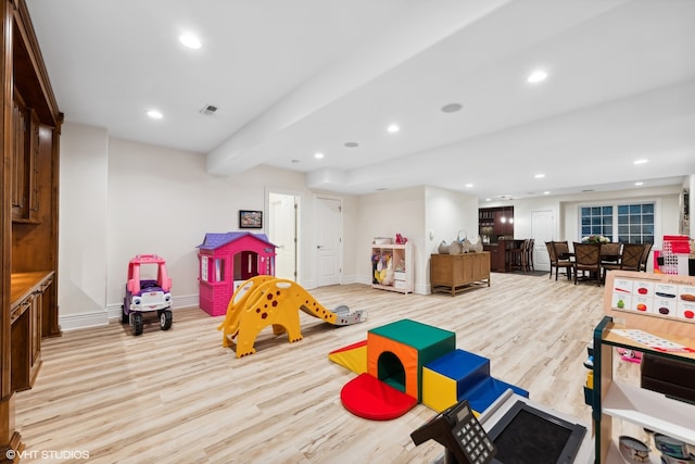 recreation room with light hardwood / wood-style flooring