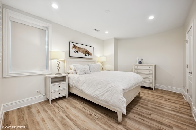 bedroom with light wood-type flooring