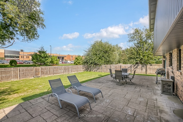 view of patio featuring a grill