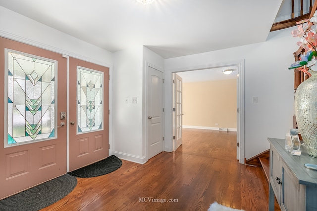 entryway featuring hardwood / wood-style floors and french doors