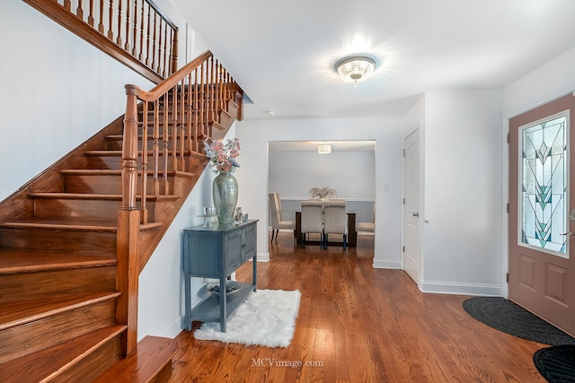 foyer featuring dark wood-type flooring