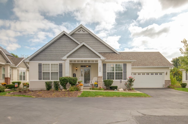 craftsman-style home with a garage and covered porch