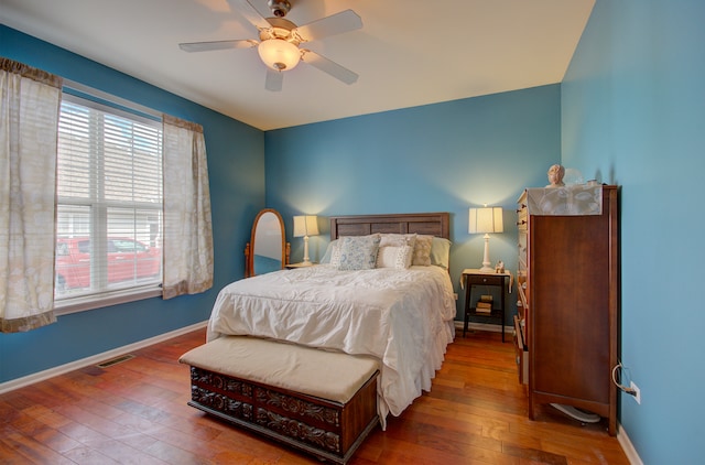 bedroom with wood-type flooring and ceiling fan