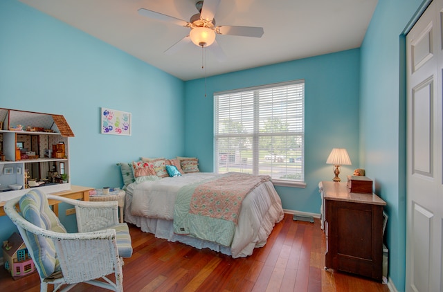 bedroom featuring ceiling fan and hardwood / wood-style floors