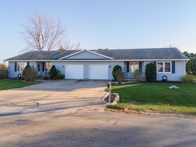 ranch-style house with a front lawn and a garage