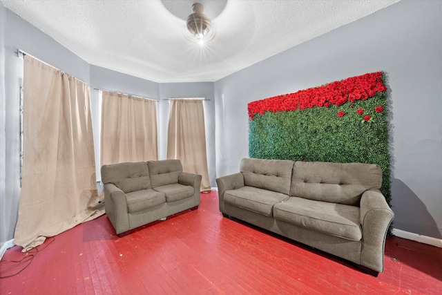 living room featuring a textured ceiling and hardwood / wood-style flooring