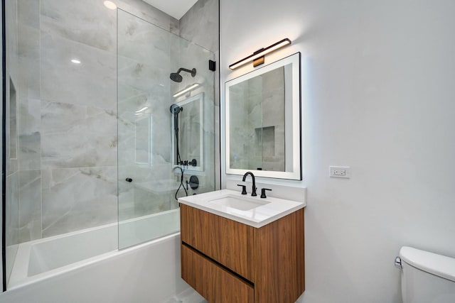 full bath featuring toilet, bathing tub / shower combination, and vanity