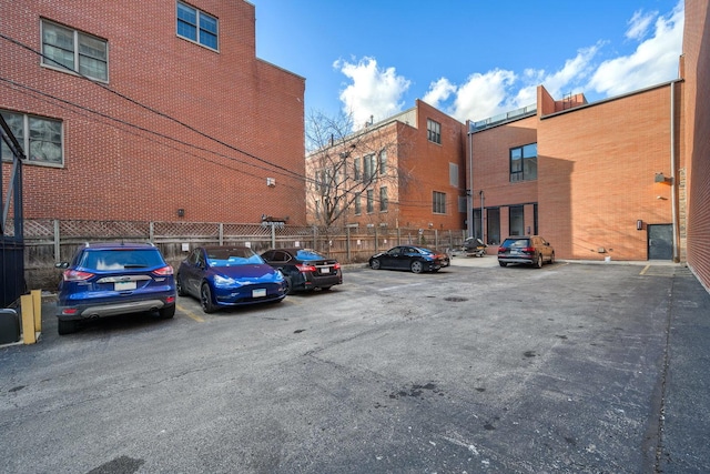 uncovered parking lot with fence