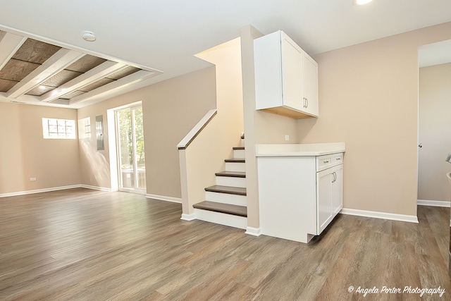 interior space featuring hardwood / wood-style flooring and beam ceiling