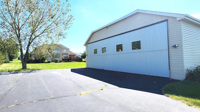 view of side of home featuring a yard