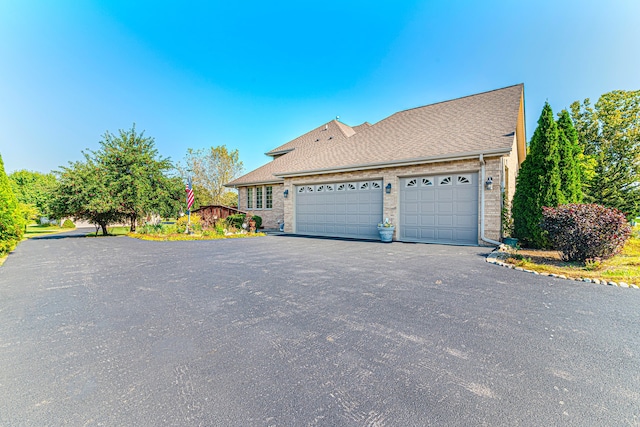 view of side of property featuring a garage