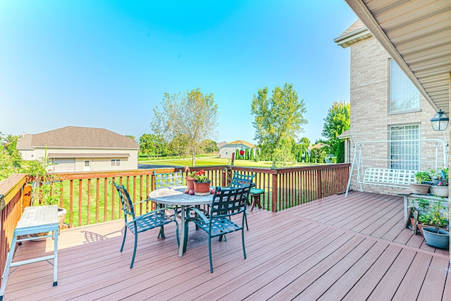 wooden terrace with a yard