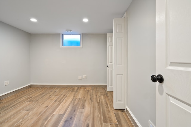 basement featuring light hardwood / wood-style floors