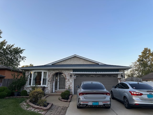 single story home featuring a garage