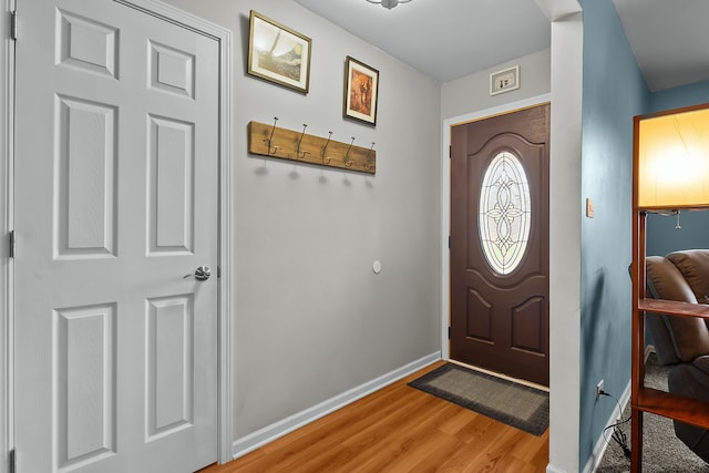 foyer entrance featuring hardwood / wood-style floors