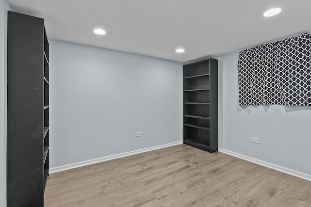 spare room featuring light hardwood / wood-style flooring