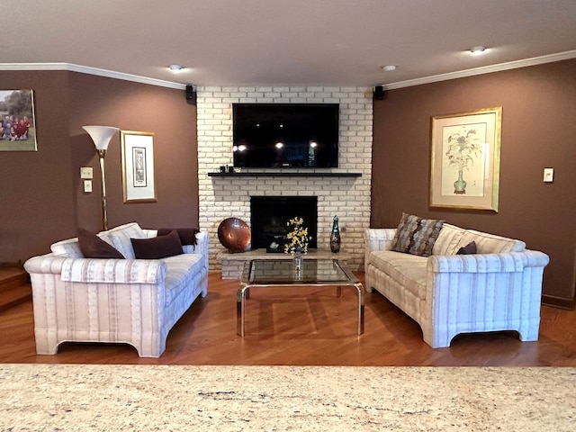 living room featuring a brick fireplace, dark hardwood / wood-style floors, and crown molding