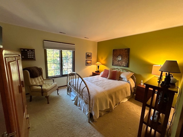 bedroom with light colored carpet