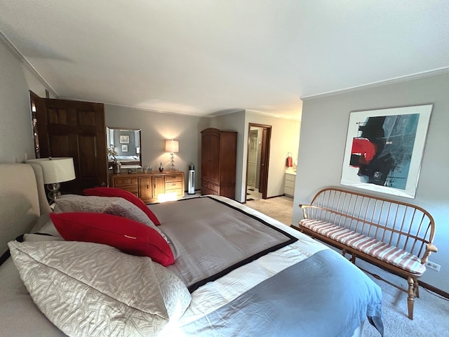 carpeted bedroom with ensuite bathroom