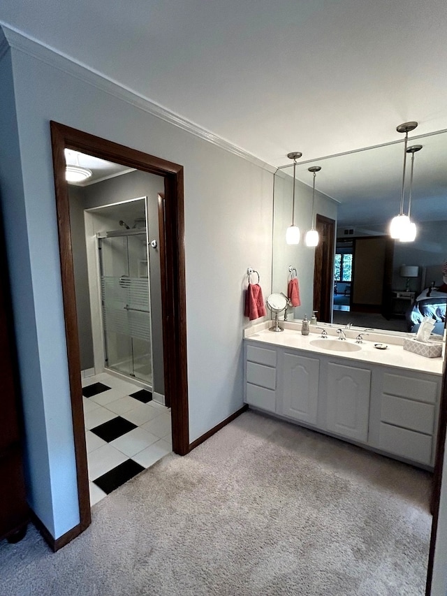 bathroom featuring tile patterned flooring, an enclosed shower, and vanity