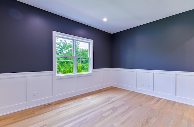 unfurnished room featuring light hardwood / wood-style floors