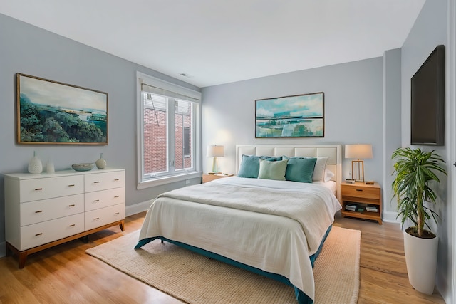 bedroom with light hardwood / wood-style flooring