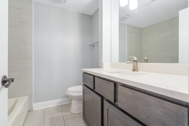 full bathroom with vanity, tiled shower / bath combo, toilet, and tile patterned floors