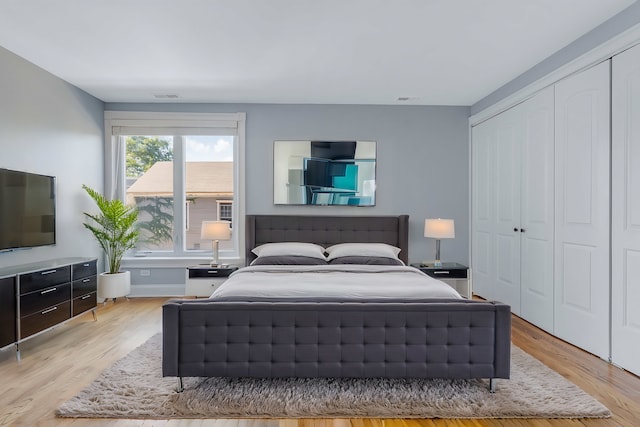 bedroom with a closet and light wood-type flooring