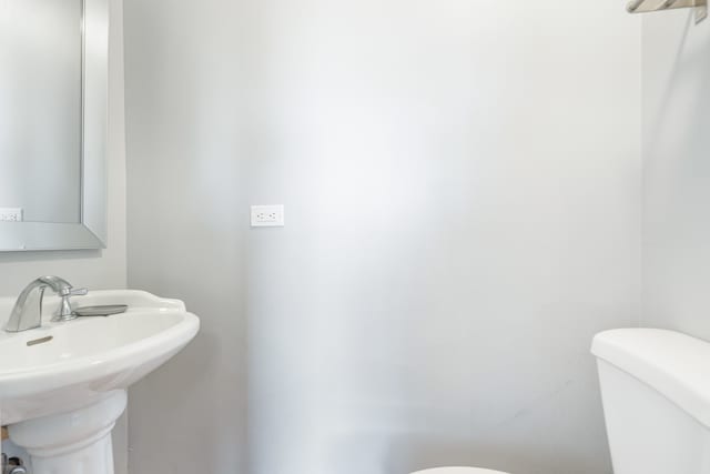 bathroom with sink and toilet