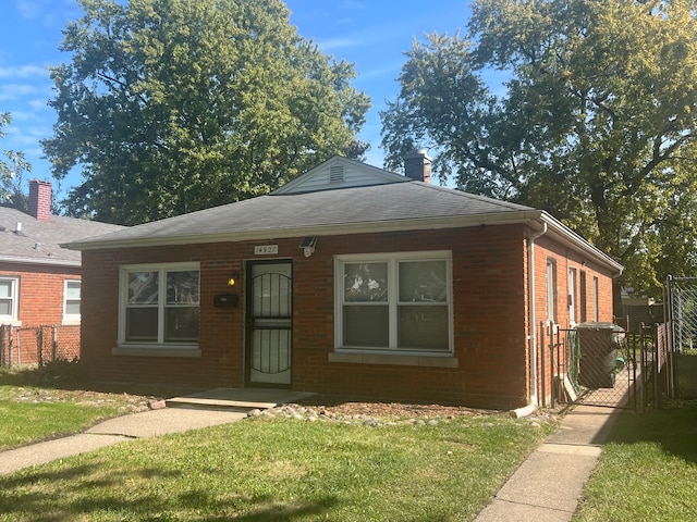 view of front of home with a front yard